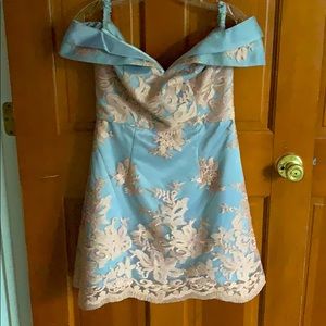 Light blue mini dress with pink embroidery.